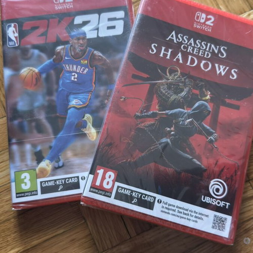 Nintendo Switch 2 games package NBA 2K26 and Assassin's Creed Shadows, sealed