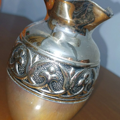 Decorative metal vase used, silver color with embossed design