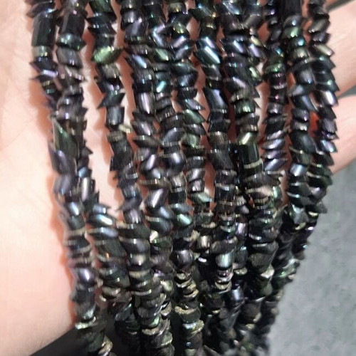 Torsade necklace used with iridescent carnival glass beads, 50cm