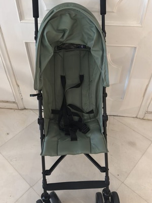 Umbrella stroller with slightly bent wheel