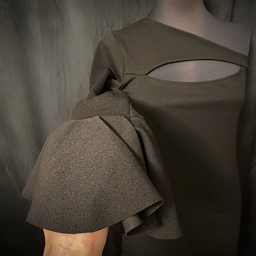 Dress new with one sleeve and ruffles black