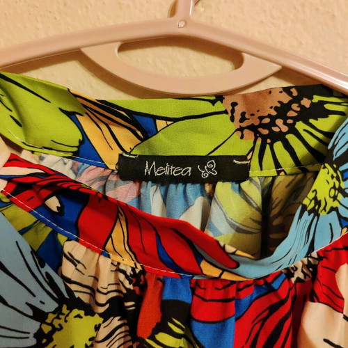 Floral sleeveless blouse new with bow at neck
