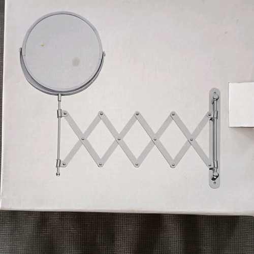 Mirror new with magnifying side and nice design