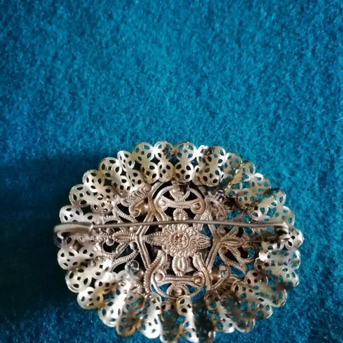 Vintage filigree brooch like new with central stone and rose crystals