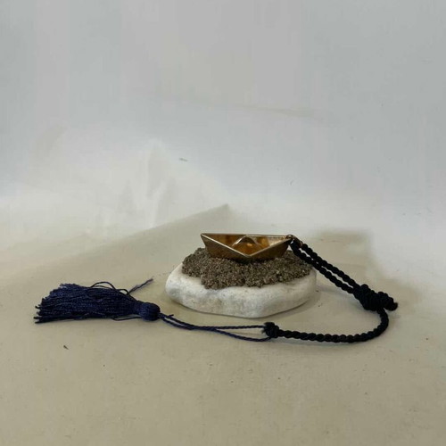 Handmade table charm with bronze boat and marble stone