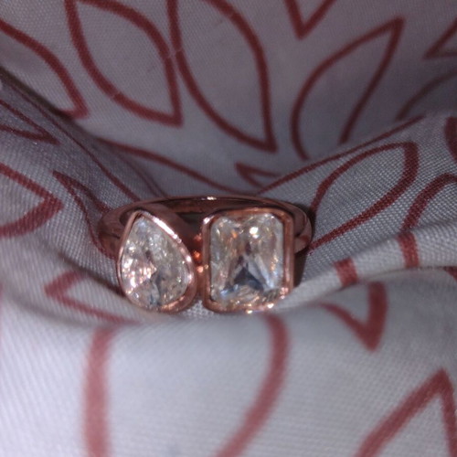 Rose gold ring with faceted rectangular and round stones