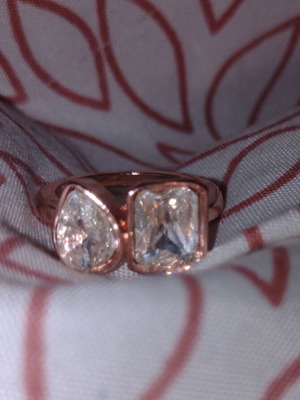 Rose gold ring with faceted rectangular and round stones