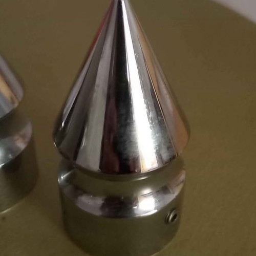 Spike-shaped caps for front wheel axle