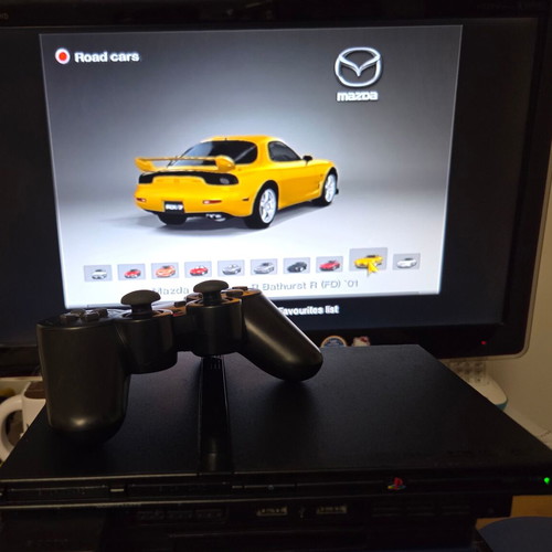 Sony PlayStation 2 SCPH-75004 Slim console used with Dualshock and accessories