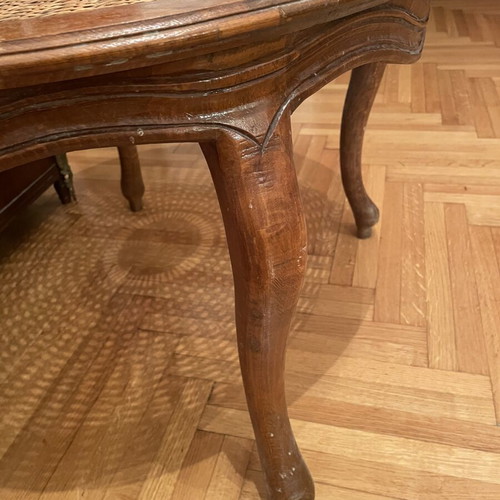 Oval living room coffee table with rattan and carved medallion