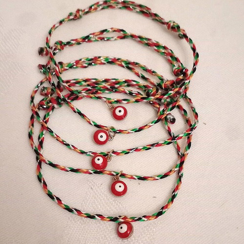 Gourakia bracelets set of 5 with red eye new