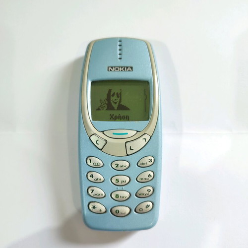 Nokia 3330 phone used with charger and buttons