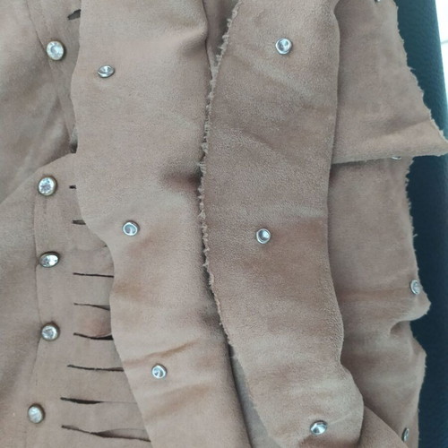 Skirt used with suede-type fringes and matte antique gold details