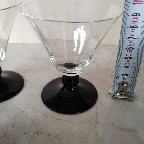Vintage thin-walled glass glasses with black stem used, retro style