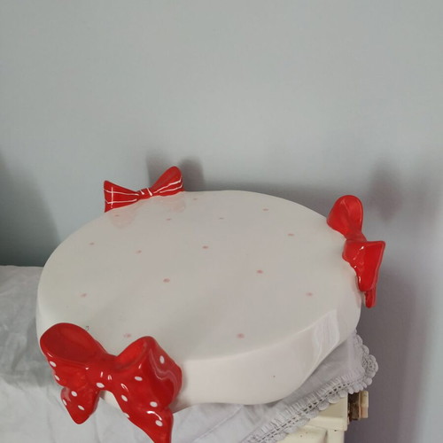 Small ceramic platter with bows in good condition