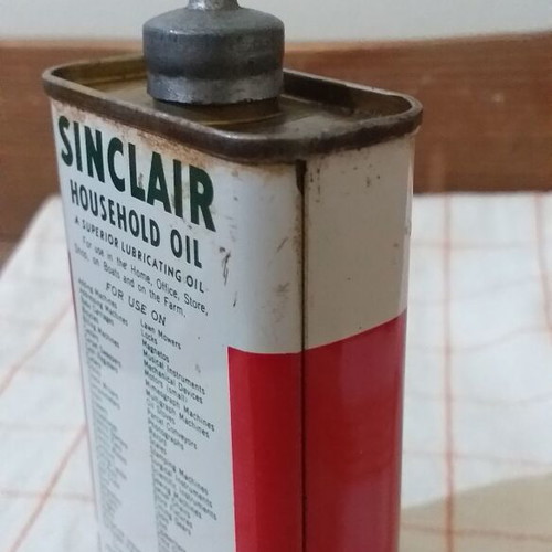 Set of 4 used oil collectors with iron, tin, and plastic