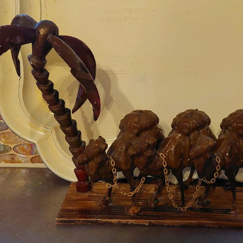Decorative item used with camels and palm tree made of wood and plastic