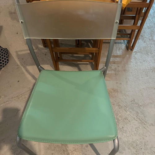 Glass dining table with extension and 4 used chairs, light green