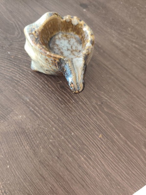 Ceramic ashtray in shell shape used