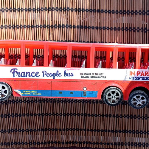 Red plastic bus toy vehicle