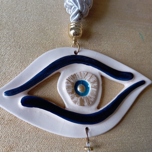 Handmade hanging eye gouri, like new, clay 15x8 cm