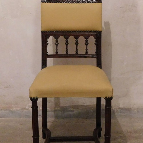 Wood-carved chair with leather seat like new, about 100 years old
