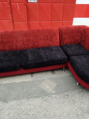 Corner sofa used, black and red, 3m x 1.8m