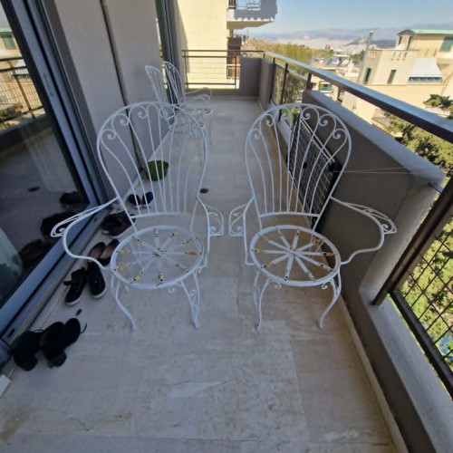 Wrought Iron Outdoor Set used, 4 chairs, 1 armchair, glass table