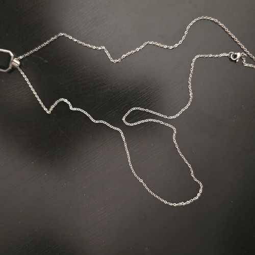 Silver necklace with geometric pendant and black stone, like new