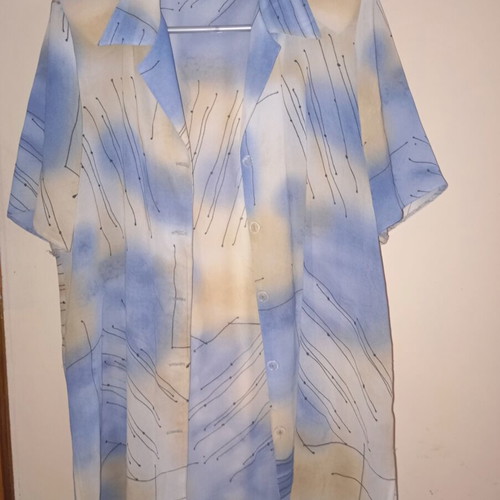 Light vintage women's shirt with short sleeves, buttons, collar, abstract print