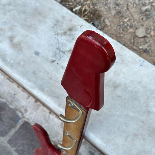 Wall hanger in electric guitar shape used, handmade with metal hooks