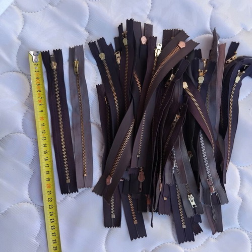 Metal and plastic sewing zippers YKK, assorted colors and sizes, pack