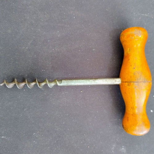 Vintage bottle opener with wooden handle used