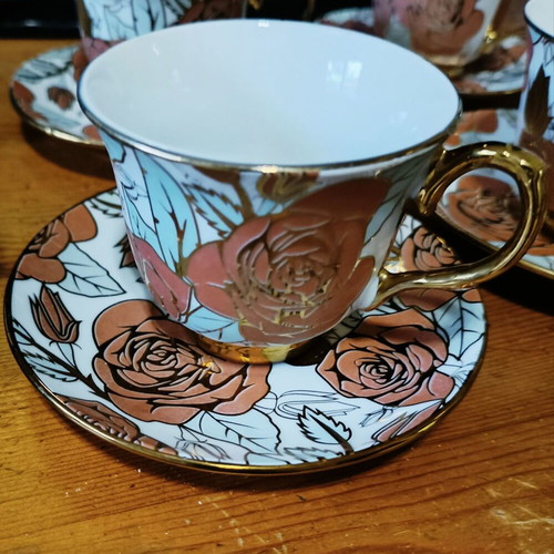 Tea and coffee set new with gold trim and rose design