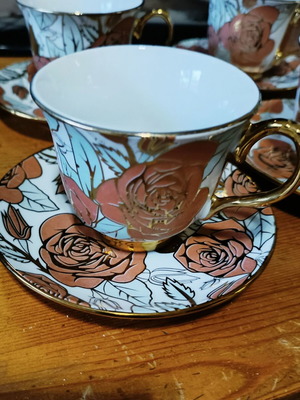 Tea and coffee set new with gold trim and rose design