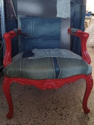 Vintage armchair with red frame and denim upholstery