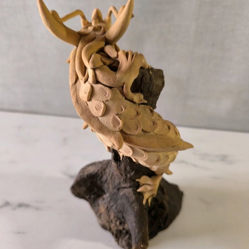 Wooden handmade dragon used with wooden base