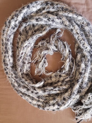 Scarf used in white and gray