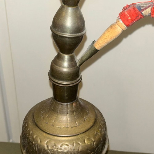 Vintage brass decorative hookah with embossed designs, used