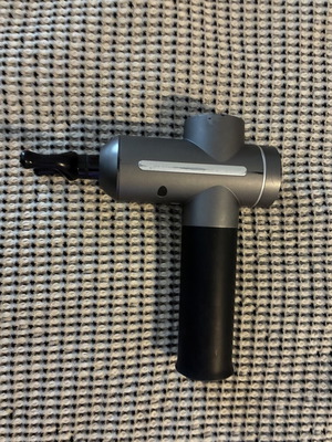 Massage gun used for muscle relaxation and stress relief