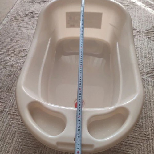 Baby Bathtub like new, beige with anti-slip surface and drain plug