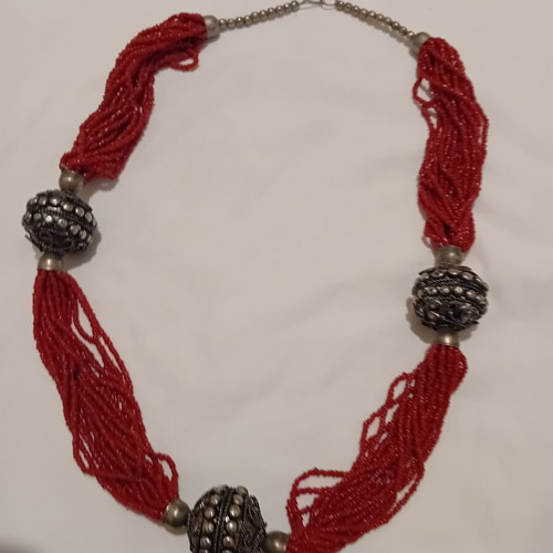 Red multistrand necklace with silver beads used