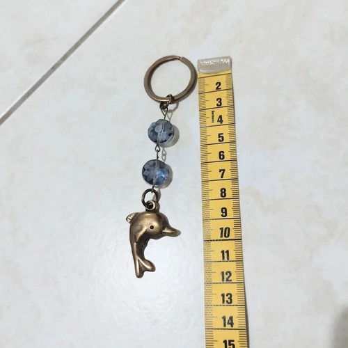 Keychain with dolphin keyholder, like new, gold and blue