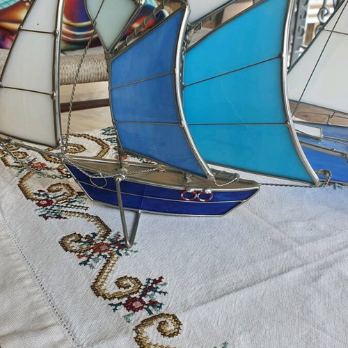 Set of sailboats like new made of steel and glass