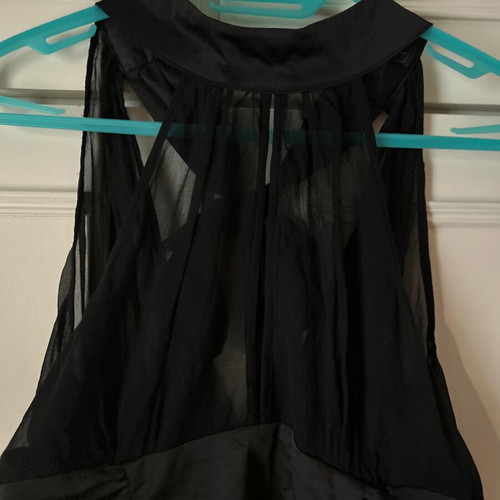 Twentyone L, women's black blouse, made of satin and muslin. The bow at the back.