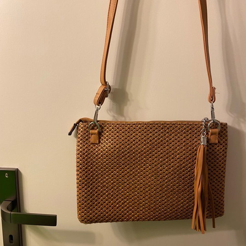 Bag with woven design and tassel