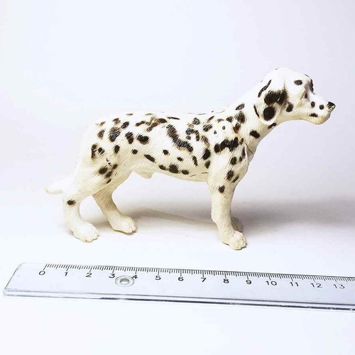 Plastic dog figure used with marks and scratches