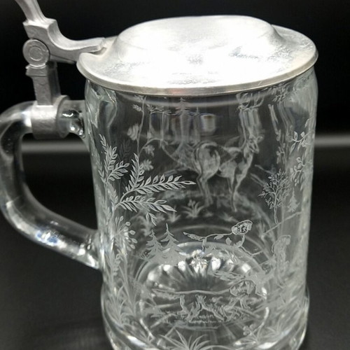 Glass beer mug with embossed hunting design like new from West Germany