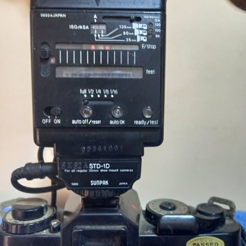 Revueflex AC2 35mm SLR film camera used with Sunpak Auto 26 DX flash