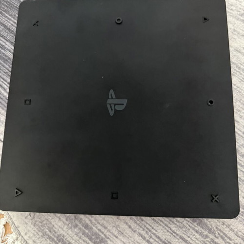 PlayStation 4 Slim 1TB console used with original Sony controller